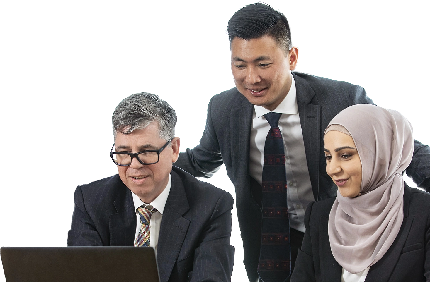 Three professionals collaborating around a laptop